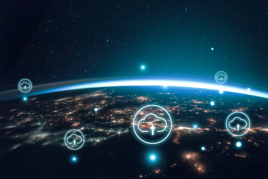 Night image of sparkling cities and a sliver of daylight framing